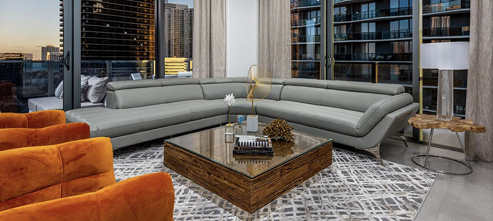 View of a danish sofa in grey fabric, very modern living space.