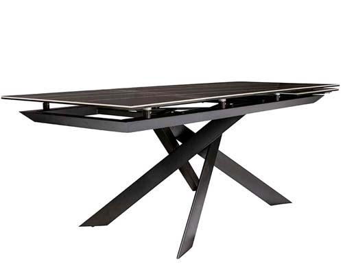  Forenza modern dining table featuring an expandable Sahara Noir ceramic top and distinctive cross-legged base, ideal for stylish, versatile dining areas. Now available at MH2G Furniture Showrooms.